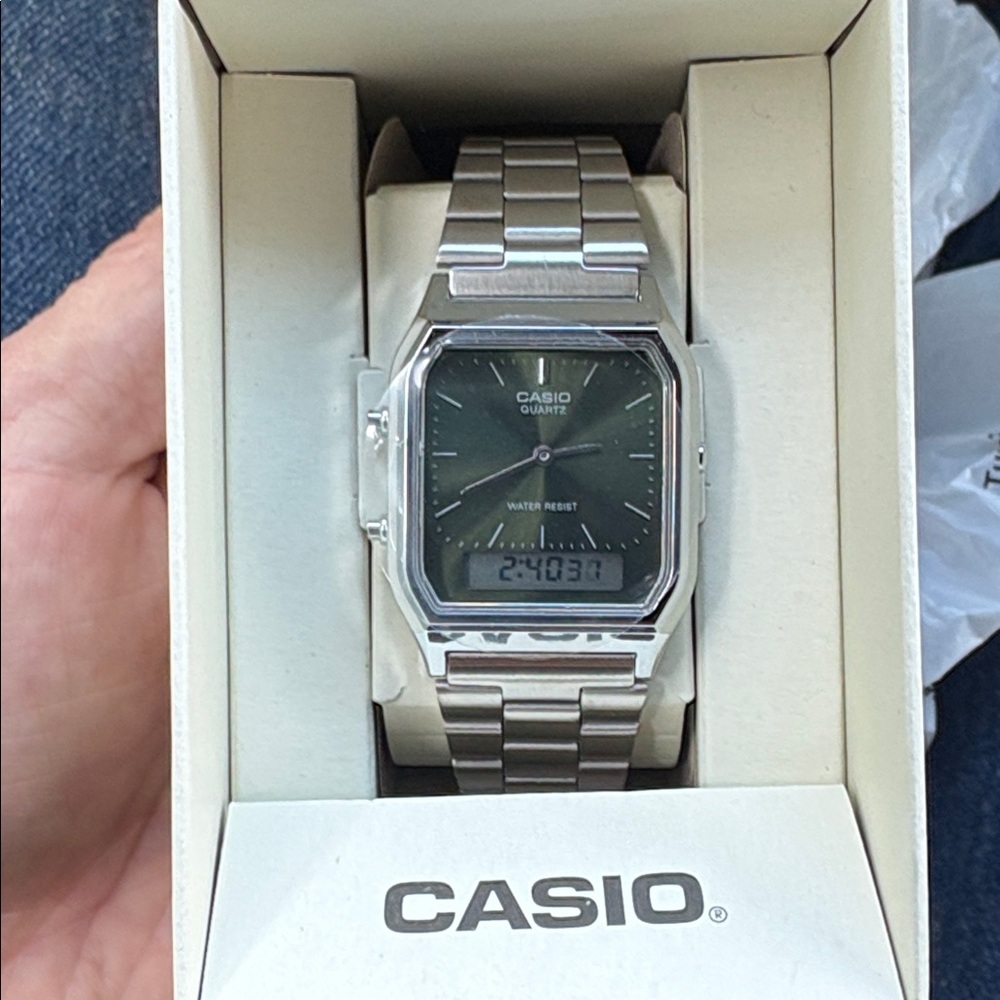 Casio Silver and green face watch